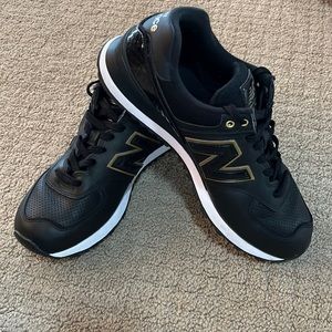 New Balance 584 athletic shoes, Black Leather with Gold accents, Size 9.5